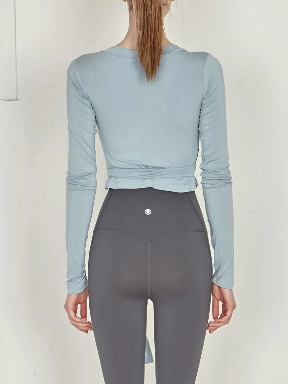 Tied Surplice Long Sleeve Top.