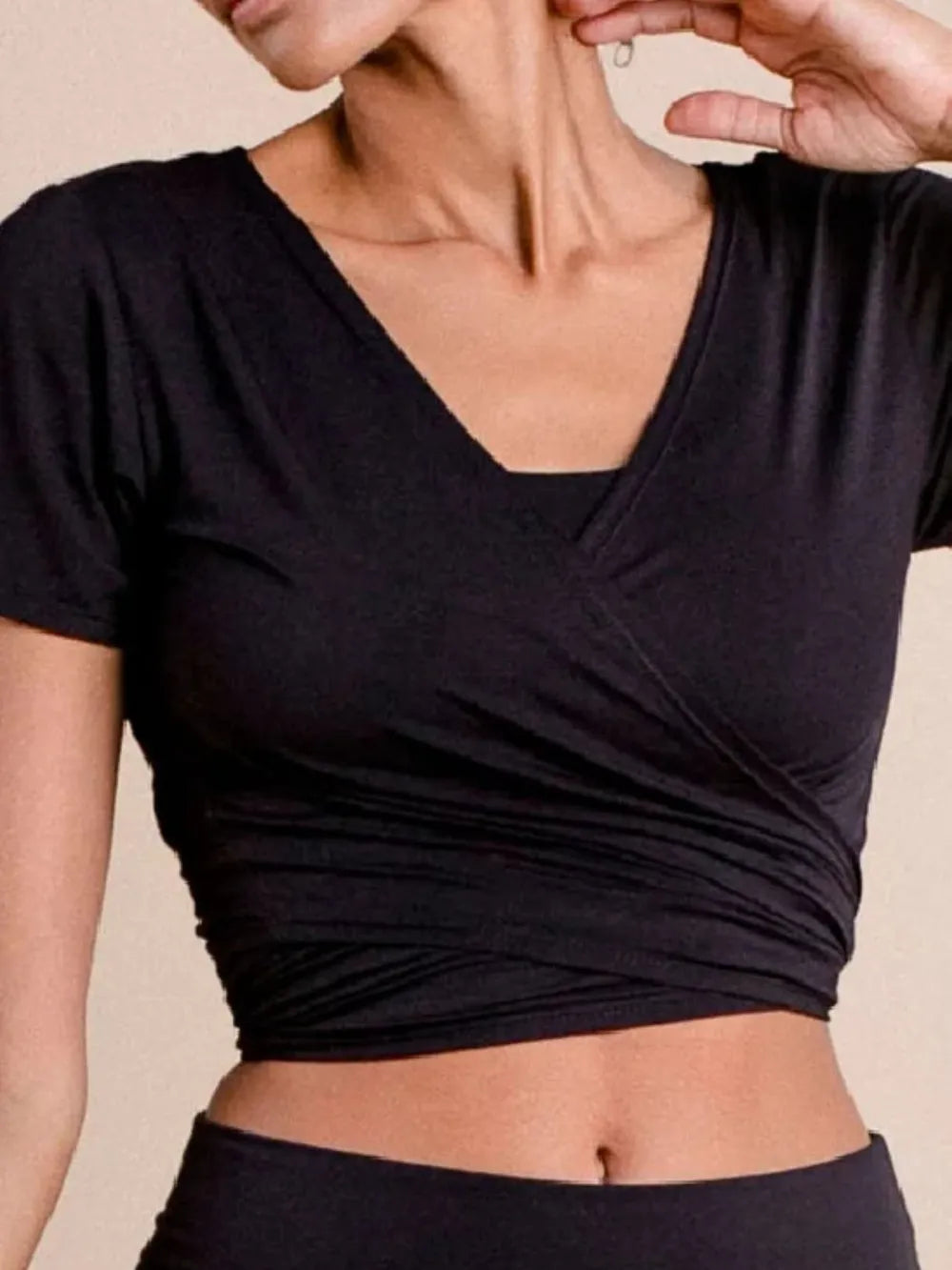 Tied Surplice Short Sleeve Top.