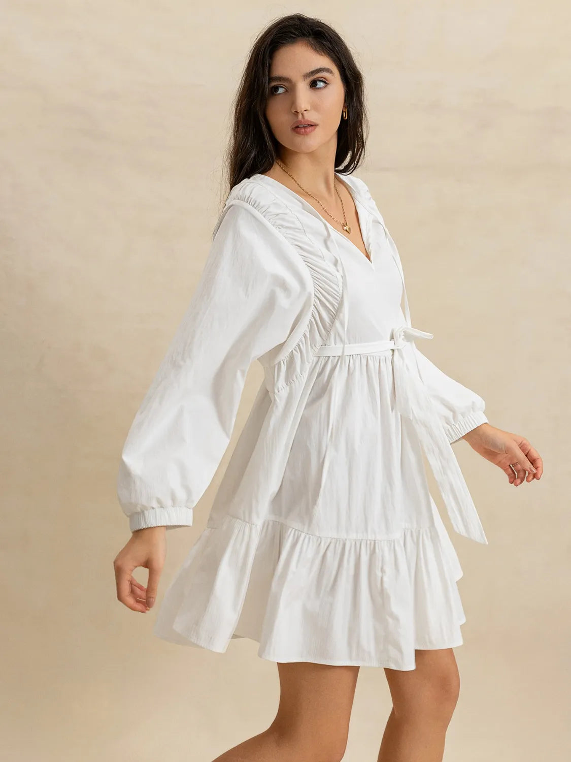 Tiered Tie Neck Long Sleeve Mini Dress.