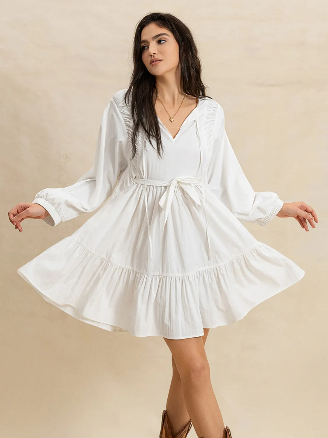 Tiered Tie Neck Long Sleeve Mini Dress.