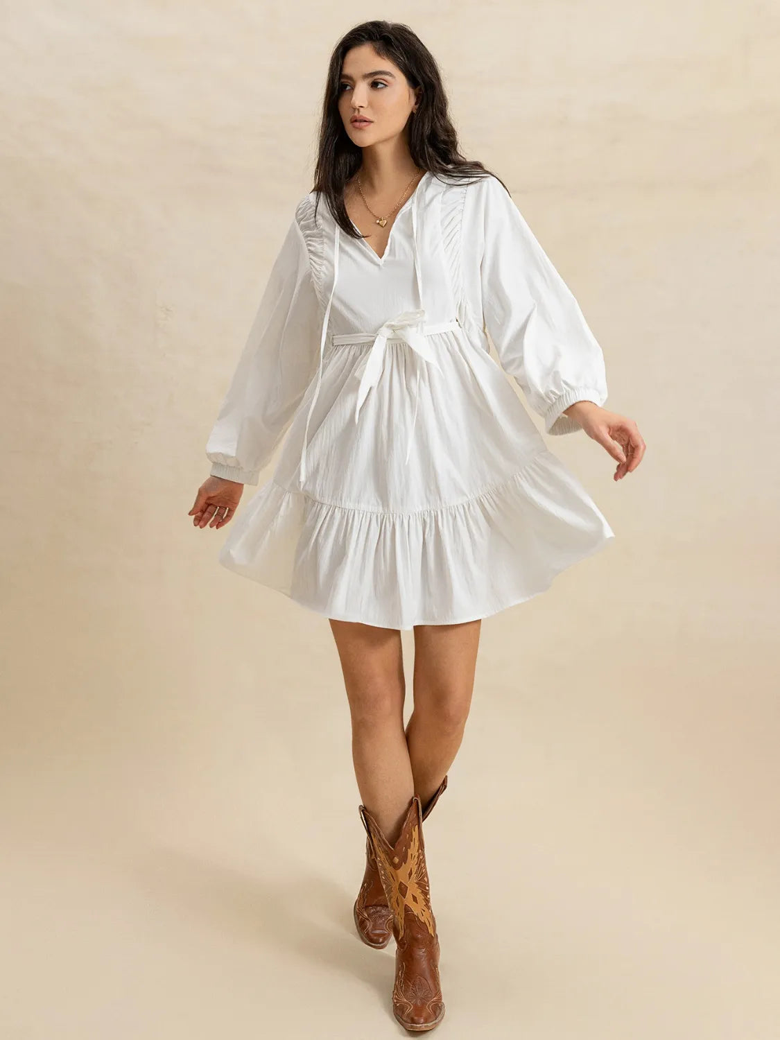 Tiered Tie Neck Long Sleeve Mini Dress.