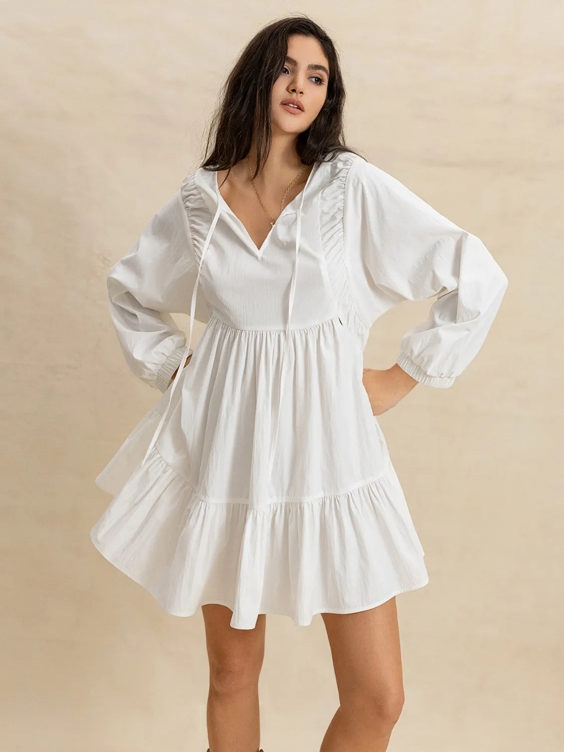 Tiered Tie Neck Long Sleeve Mini Dress.