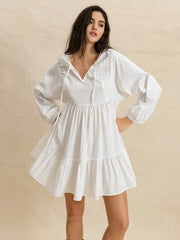 Tiered Tie Neck Long Sleeve Mini Dress.