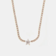 Gold-toned titanium steel zircon necklace featuring a sparkling stone-set chain and a prominent five-point star pendant.