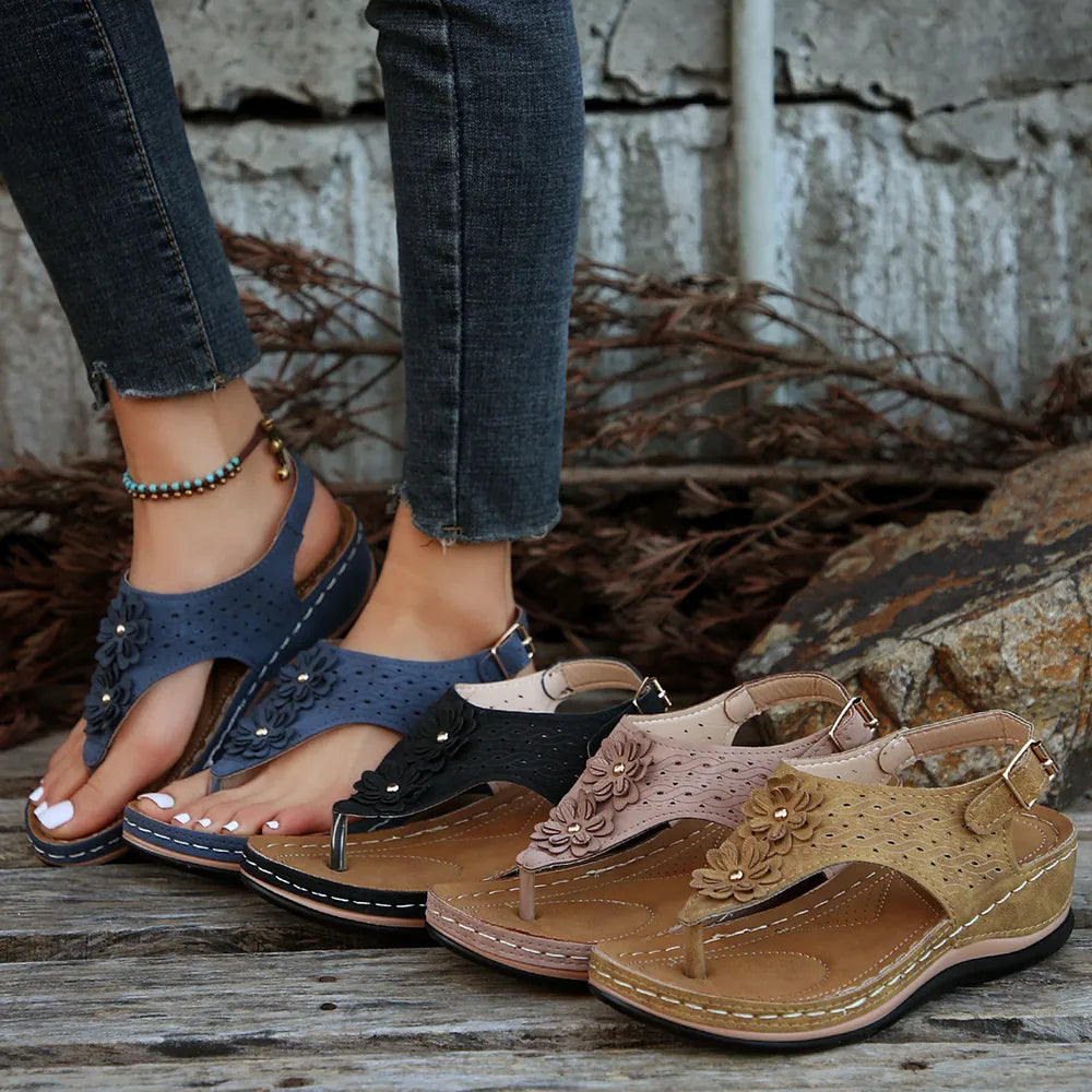 Toe post flower detail mid-heel wedge sandals.