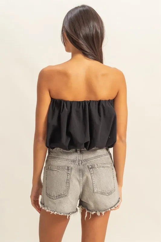 Trendy strapless bubble top with ruched and smocked details, slightly stretchy.