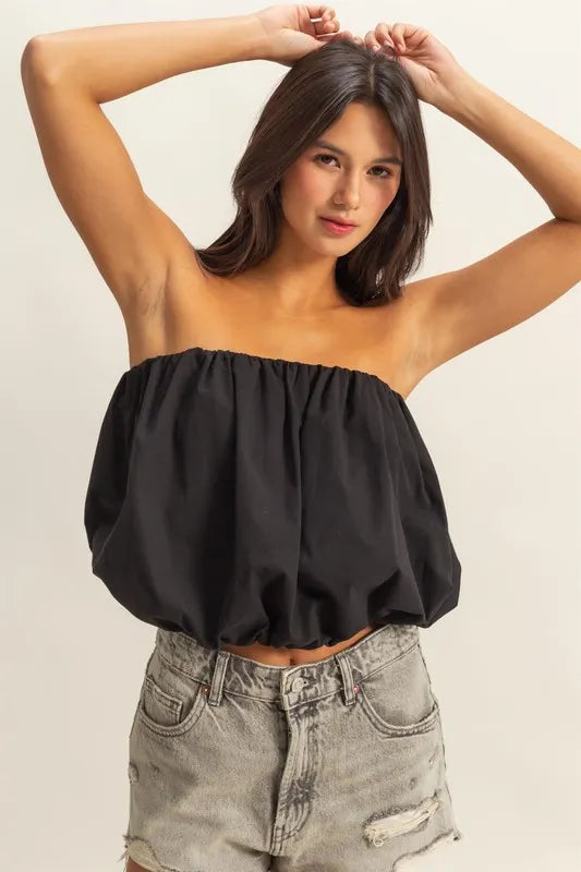 Trendy strapless bubble top with ruched and smocked details, slightly stretchy.