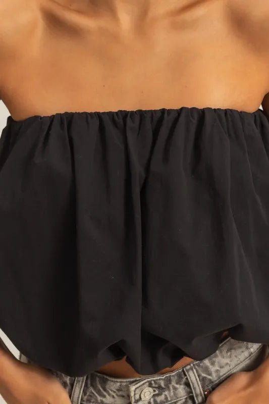 Trendy strapless bubble top with ruched and smocked details, slightly stretchy.