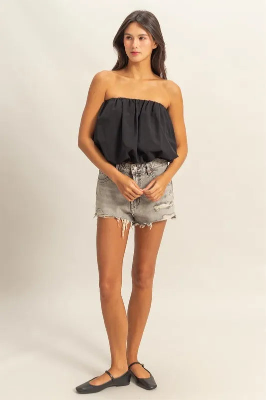 Trendy strapless bubble top with ruched and smocked details, slightly stretchy.