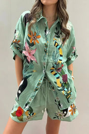 Tropical paradise floral print shirt and shorts set, women's stylish two-piece outfit, comfortable tropical print, oversized shirt, buttoned details, practical pockets, drawstring shorts, non-stretch polyester, ideal for vacation or summer outings