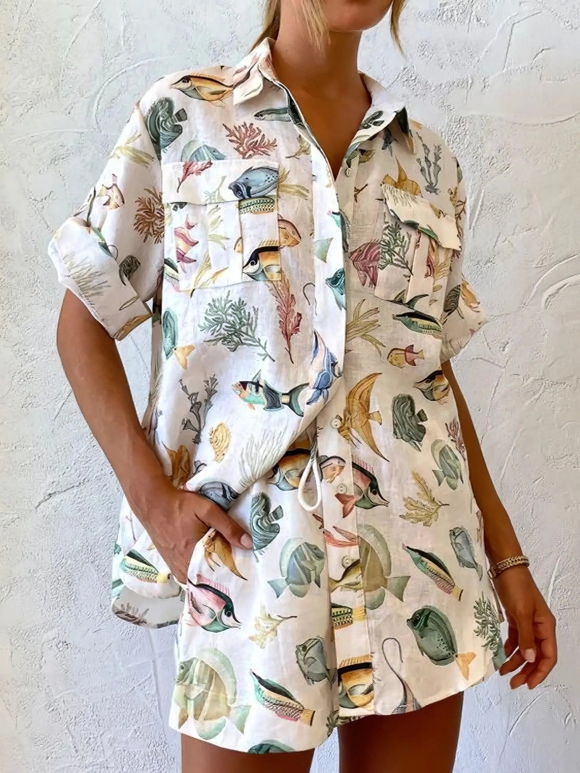 tropical print oversized button up shirt and shorts set, relaxed stylish women's outfit, vacation ready two-piece set, comfortable tropical print, oversized shirt, flowy shorts, ideal for summer getaways