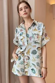 tropical print oversized button up shirt and shorts set, relaxed stylish women's outfit, vacation ready two-piece set, comfortable tropical print, oversized shirt, flowy shorts, ideal for summer getaways