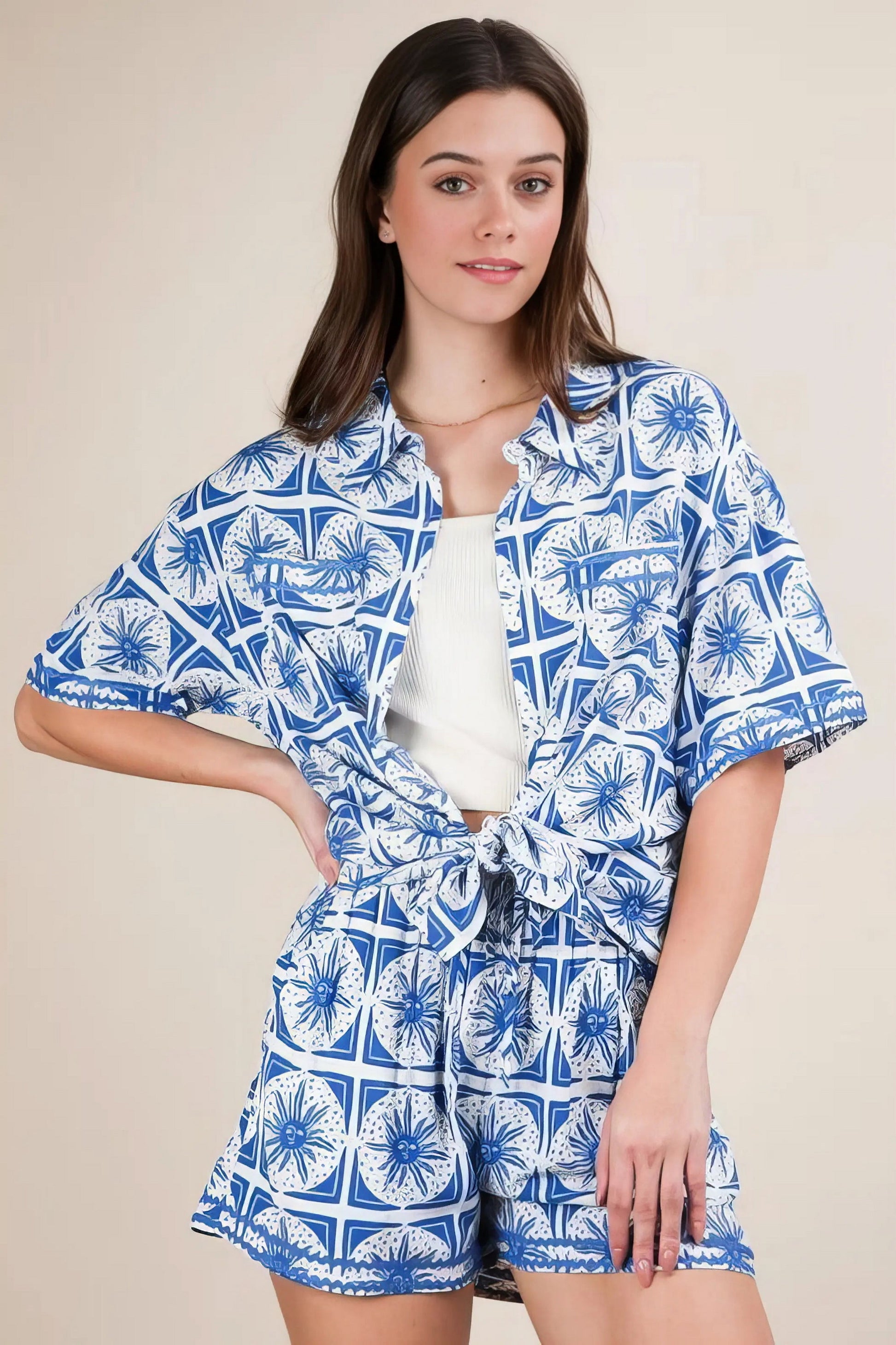 Plus size tropical printed shirt top and shorts set, women's vibrant two-piece outfit, comfortable summer set, stylish tropical print, buttoned shirt, practical pockets, drawstring shorts, slightly stretchy polyester spandex blend, ideal for beach days or tropical getaways