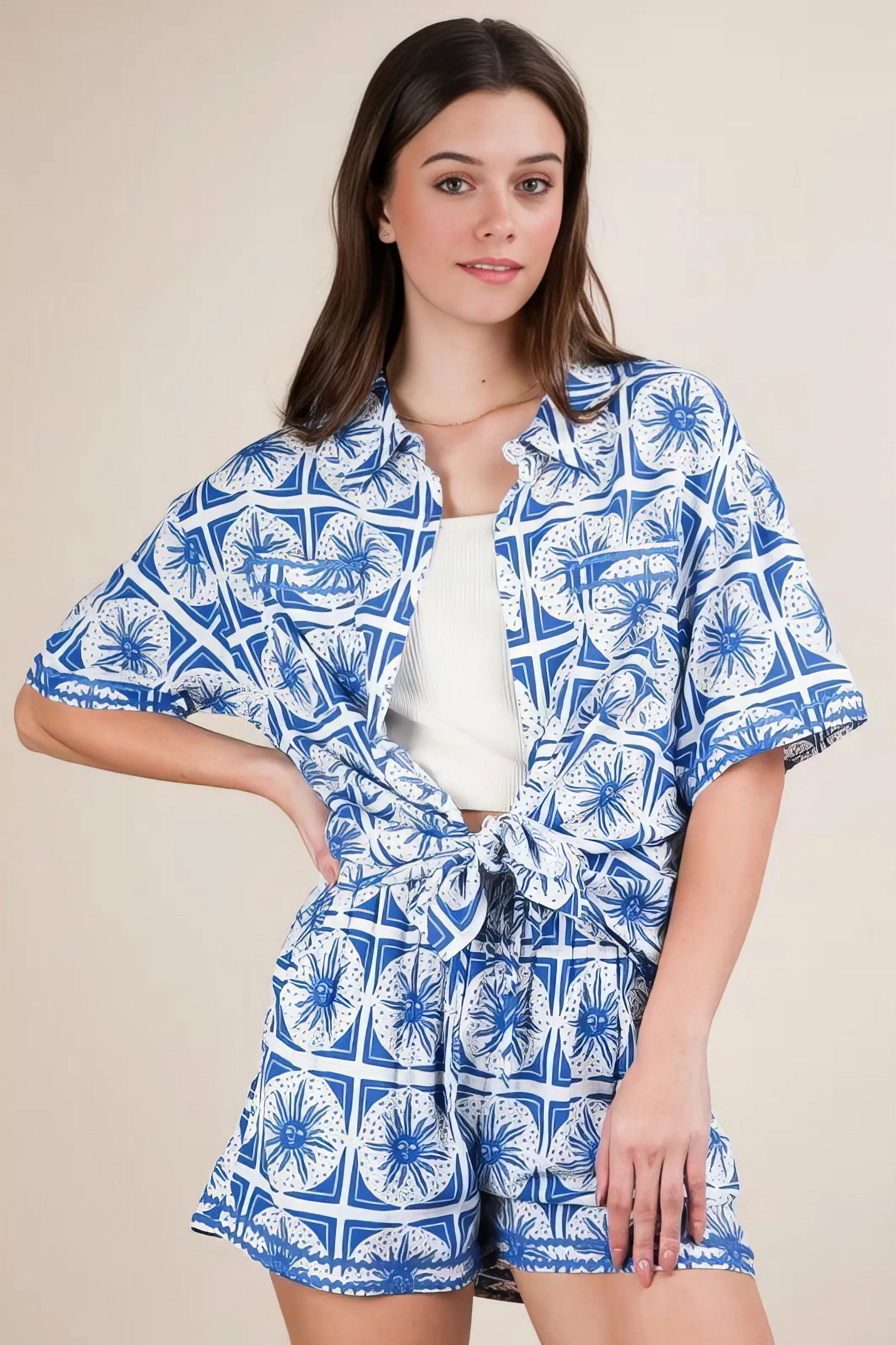 Plus size tropical printed shirt top and shorts set, women's vibrant two-piece outfit, comfortable summer set, stylish tropical print, buttoned shirt, practical pockets, drawstring shorts, slightly stretchy polyester spandex blend, ideal for beach days or tropical getaways