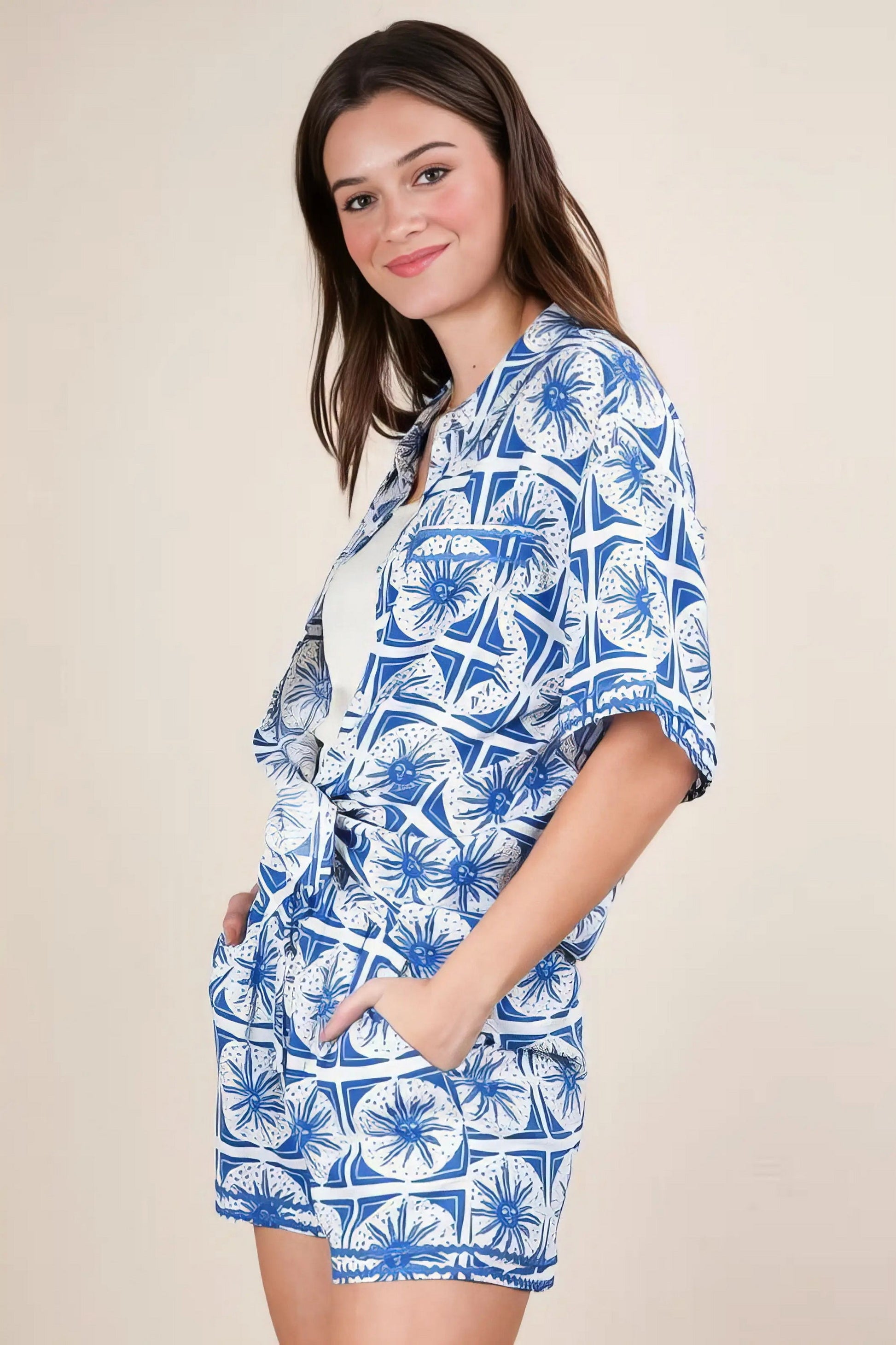 Plus size tropical printed shirt top and shorts set, women's vibrant two-piece outfit, comfortable summer set, stylish tropical print, buttoned shirt, practical pockets, drawstring shorts, slightly stretchy polyester spandex blend, ideal for beach days or tropical getaways