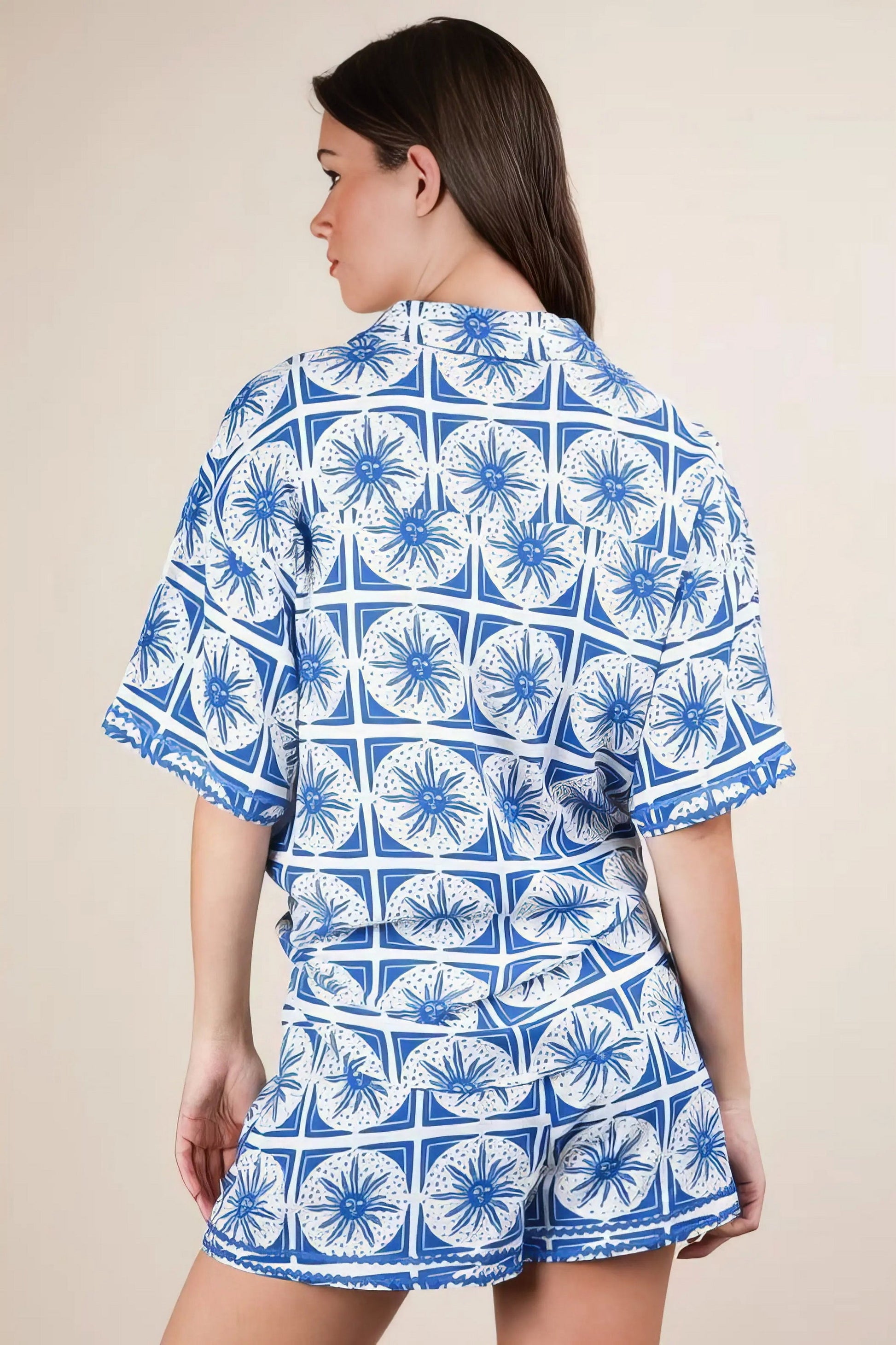 Plus size tropical printed shirt top and shorts set, women's vibrant two-piece outfit, comfortable summer set, stylish tropical print, buttoned shirt, practical pockets, drawstring shorts, slightly stretchy polyester spandex blend, ideal for beach days or tropical getaways