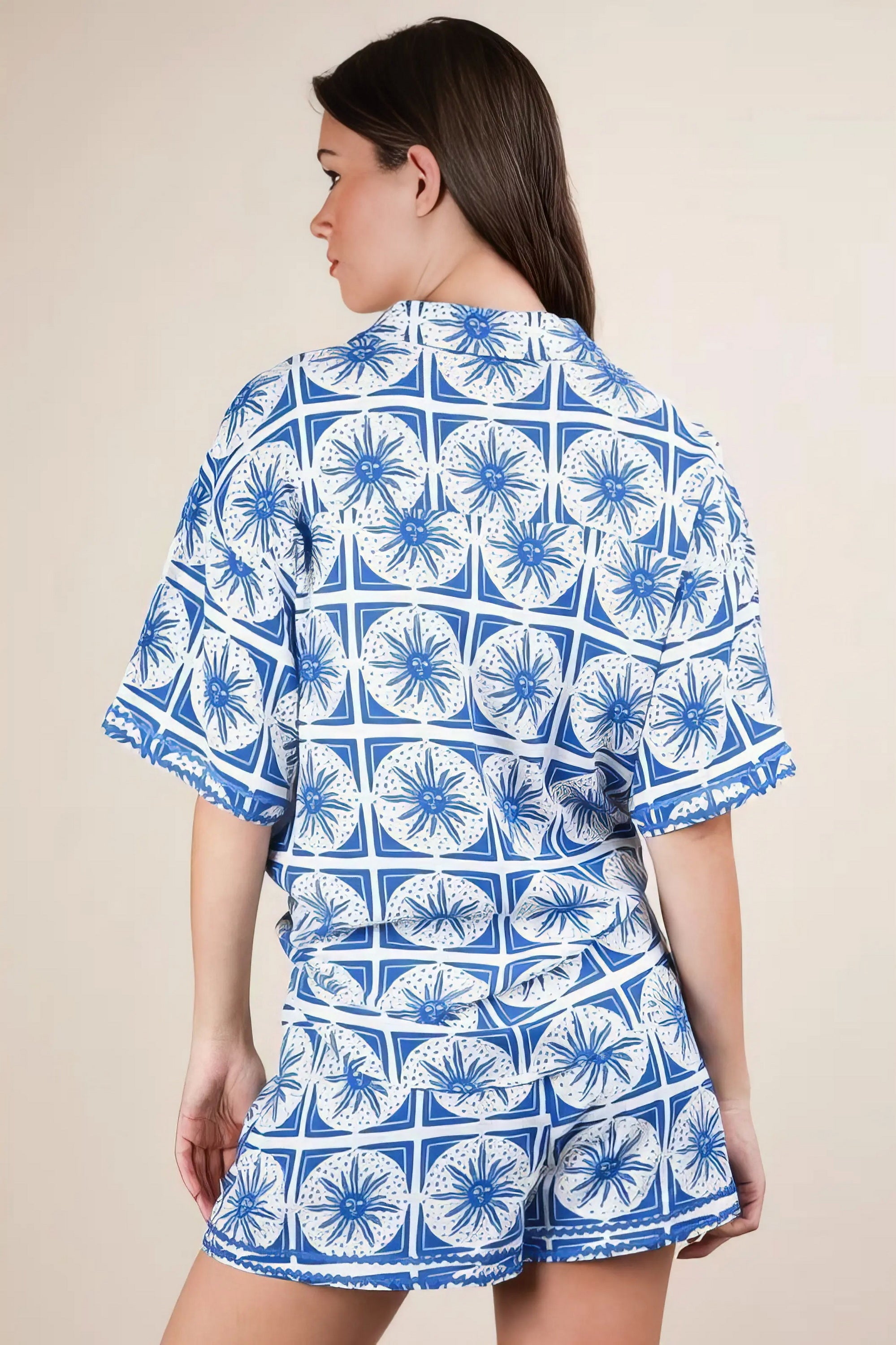 Plus size tropical printed shirt top and shorts set, women's vibrant two-piece outfit, comfortable summer set, stylish tropical print, buttoned shirt, practical pockets, drawstring shorts, slightly stretchy polyester spandex blend, ideal for beach days or tropical getaways