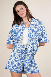 Plus size tropical printed shirt top and shorts set, women's vibrant two-piece outfit, comfortable summer set, stylish tropical print, buttoned shirt, practical pockets, drawstring shorts, slightly stretchy polyester spandex blend, ideal for beach days or tropical getaways