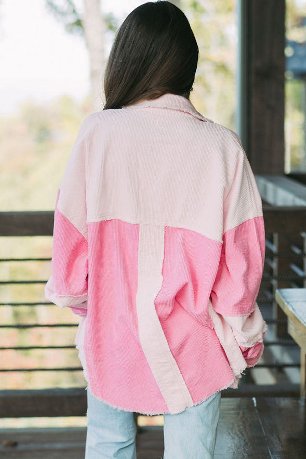 Two-tone exposed seam corduroy shacket with pockets, raw hem, and buttons.