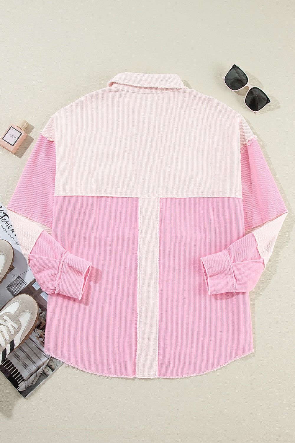 Two-tone exposed seam corduroy shacket with pockets, raw hem, and buttons.