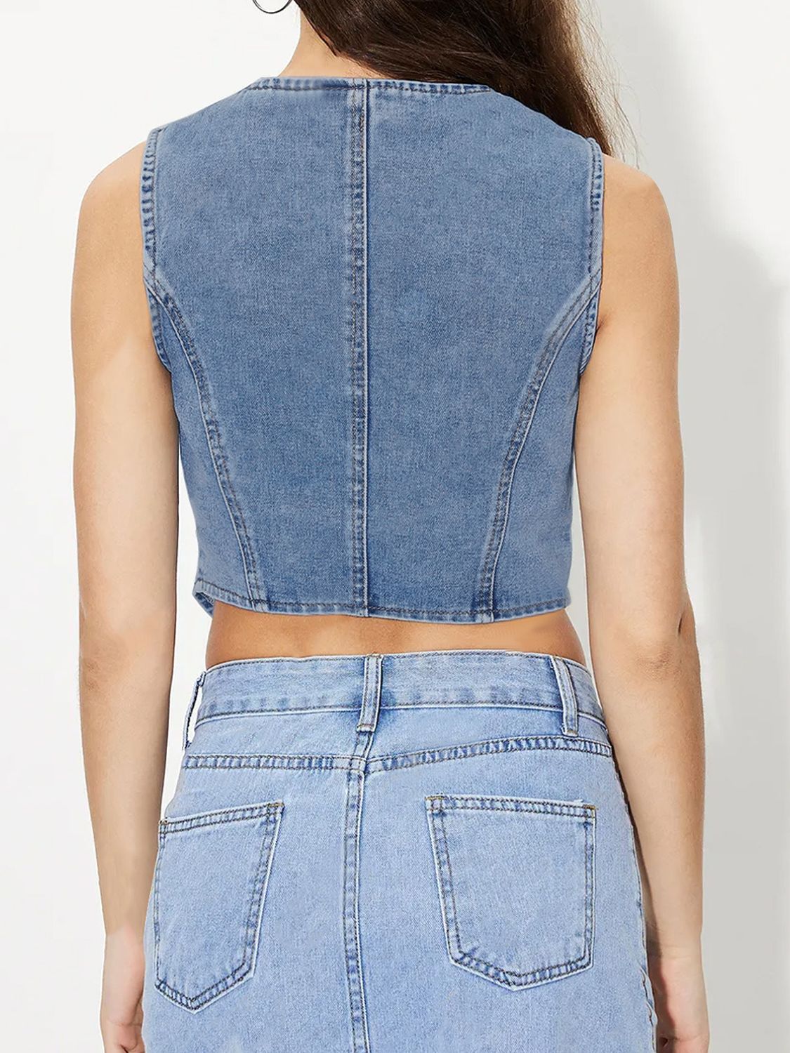 V-neck button up denim vest.