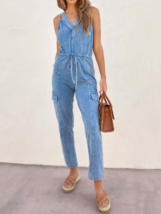 V-Neck Sleeveless Denim Jumpsuit with Pockets and Drawstring.