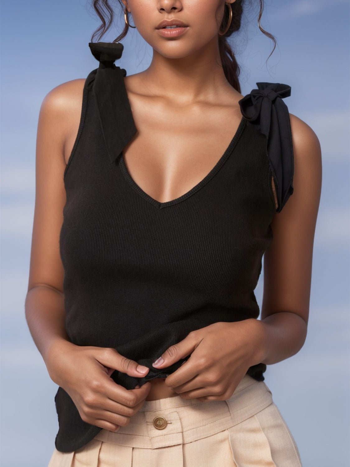V-neck tie shoulder tank with bow, moderately stretchy.