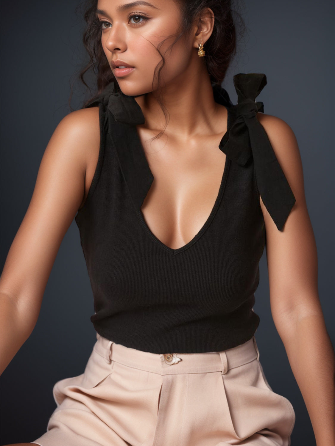V-neck tie shoulder tank with bow, moderately stretchy.