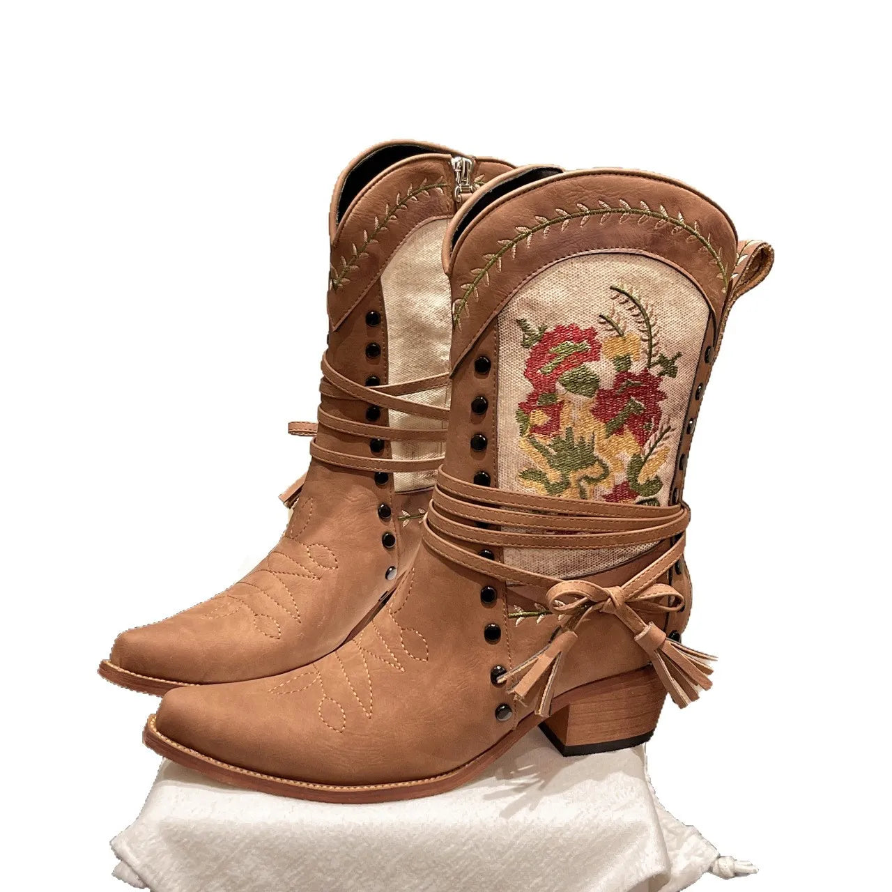 Vintage floral embroidered western cowgirl boots with low heels.