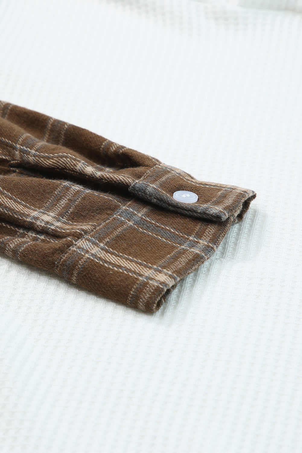 Waffle knit plaid long sleeve kangaroo pocket hoodie with drawstring.