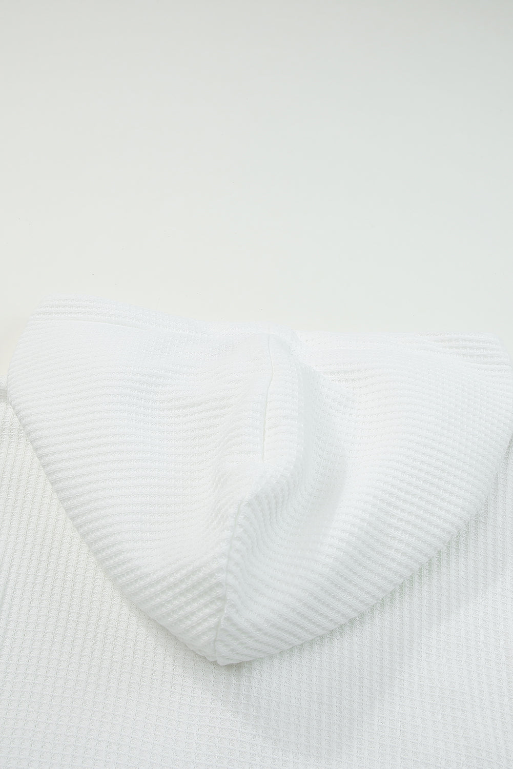 Waffle knit plaid long sleeve kangaroo pocket hoodie with drawstring.