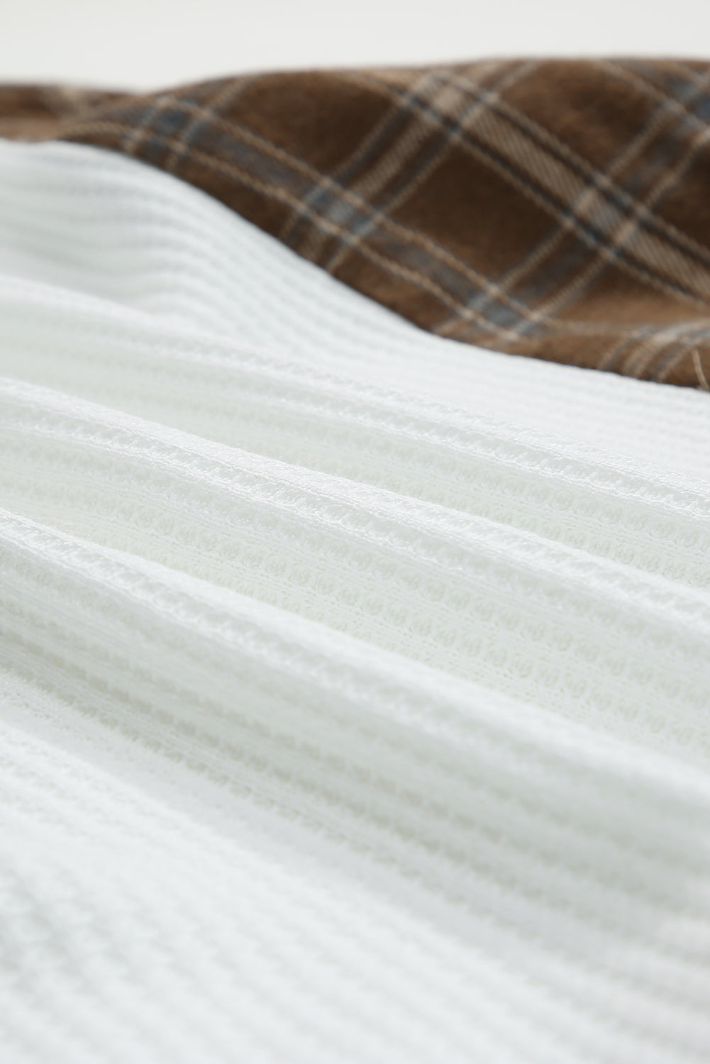 Waffle knit plaid long sleeve kangaroo pocket hoodie with drawstring.
