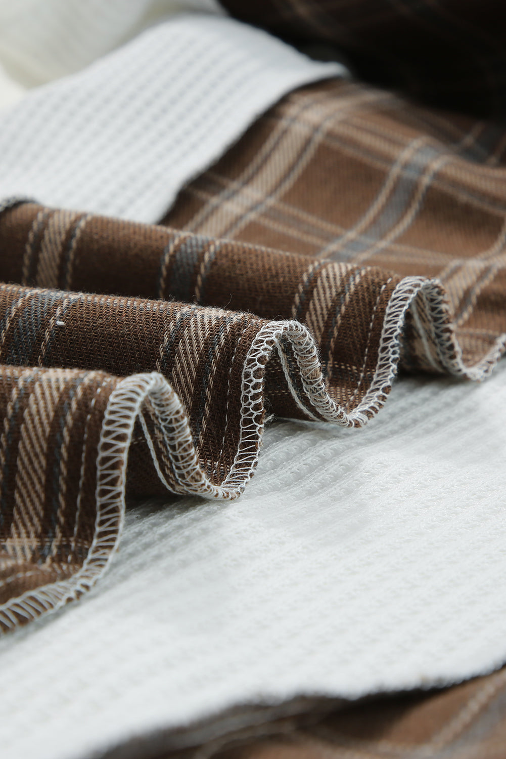 Waffle knit plaid long sleeve kangaroo pocket hoodie with drawstring.