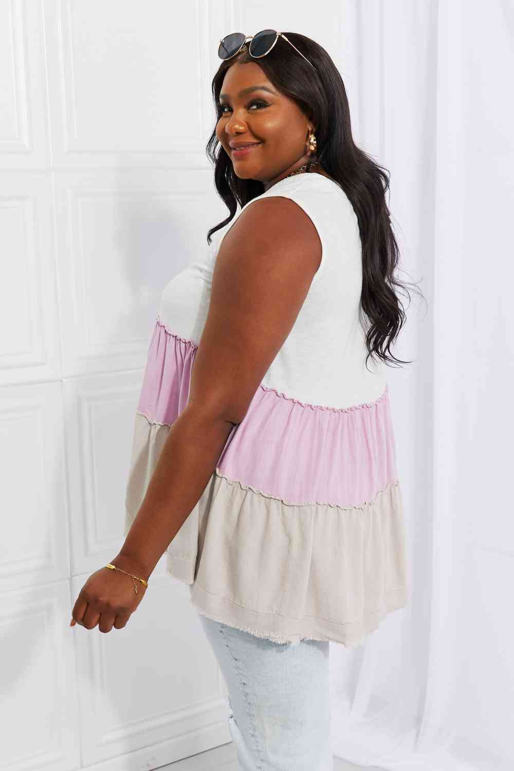 Watching the sunset color block babydoll top with tiered design, moderately stretchy.