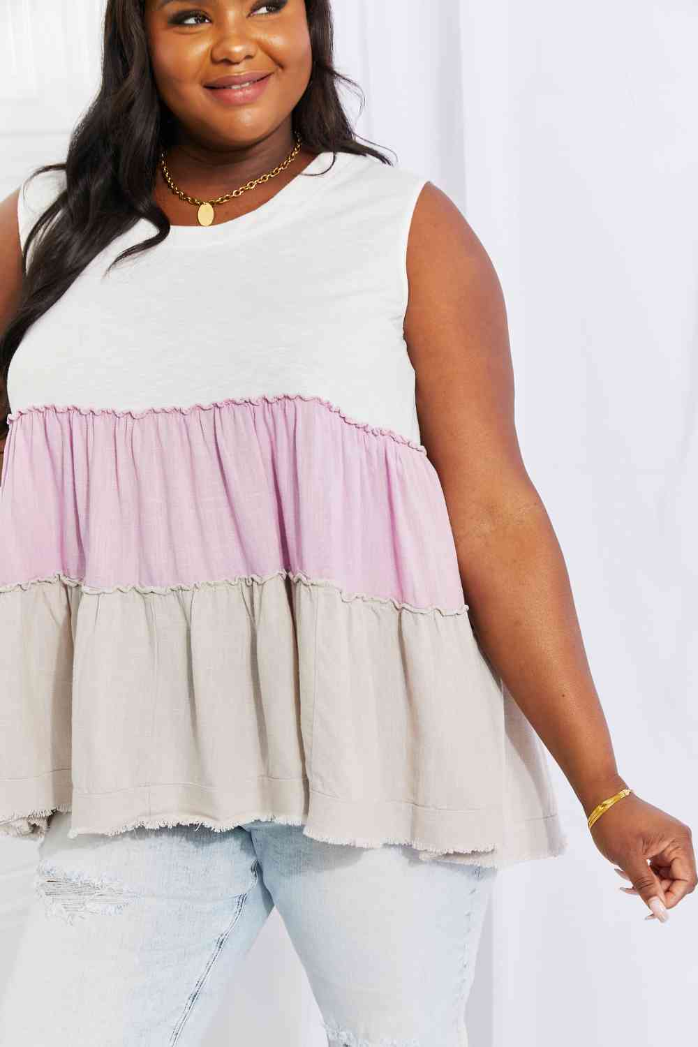 Watching the sunset color block babydoll top with tiered design, moderately stretchy.