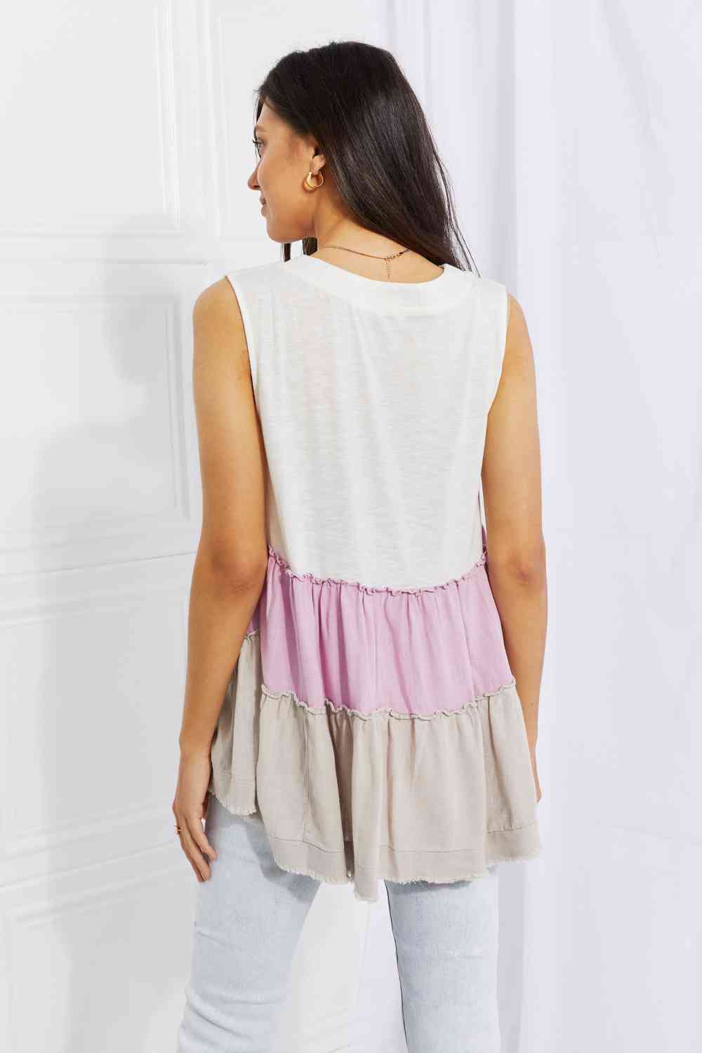 Watching the sunset color block babydoll top with tiered design, moderately stretchy.