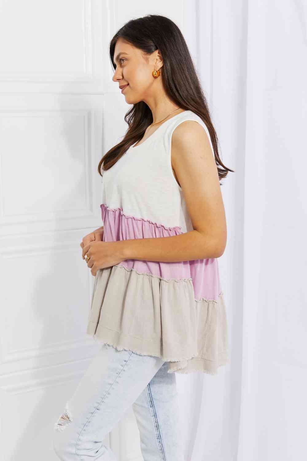 Watching the sunset color block babydoll top with tiered design, moderately stretchy.