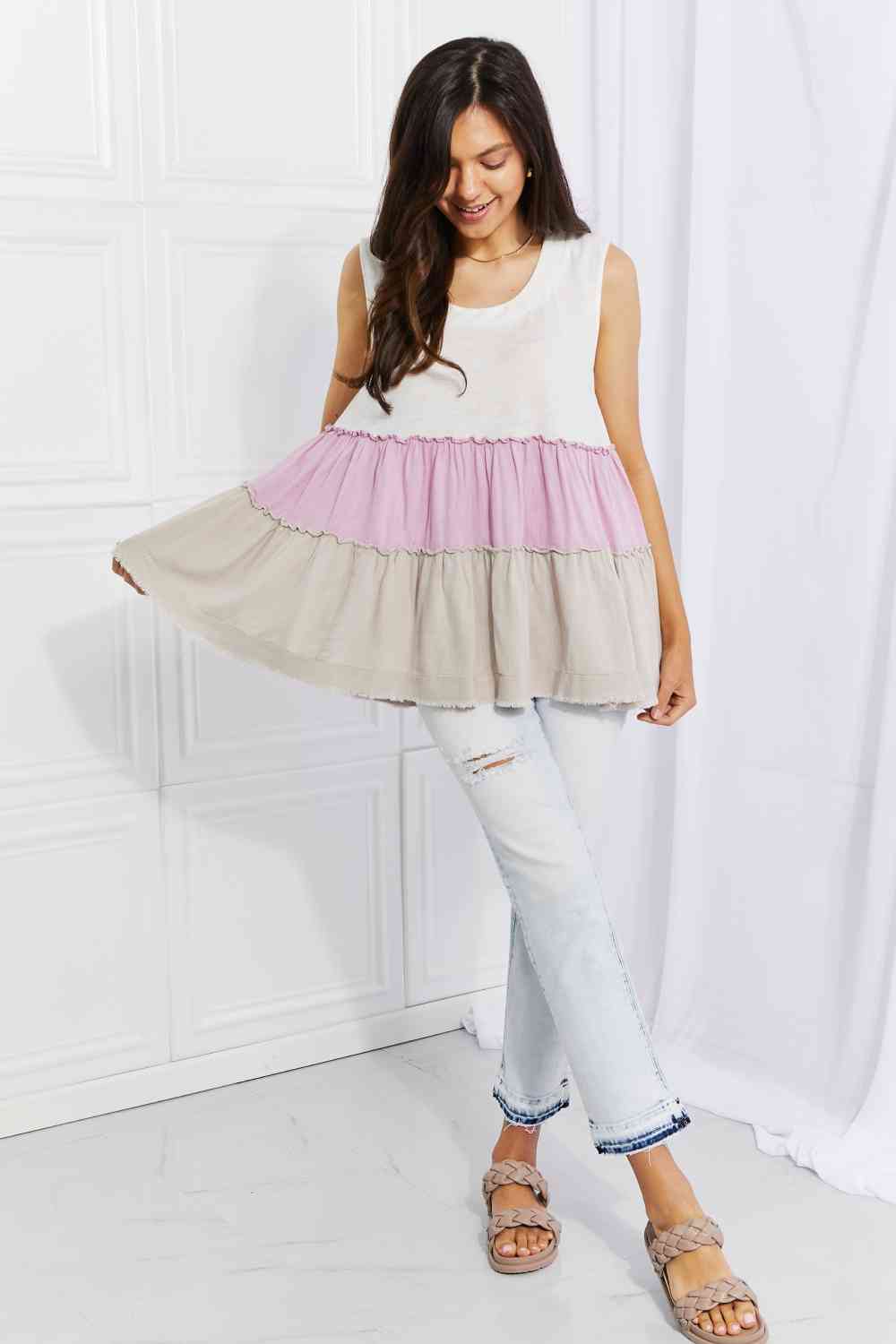 Watching the sunset color block babydoll top with tiered design, moderately stretchy.