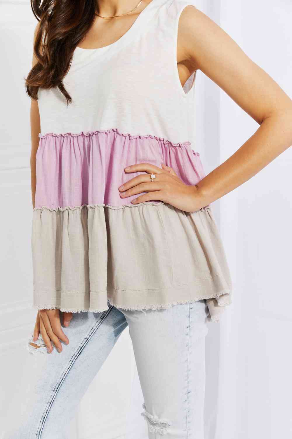 Watching the sunset color block babydoll top with tiered design, moderately stretchy.