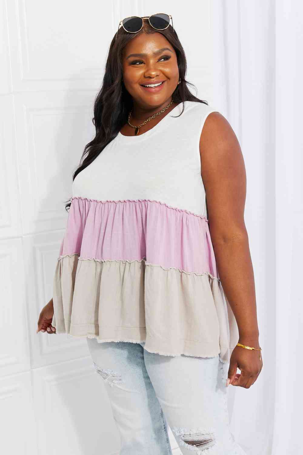 Watching the sunset color block babydoll top with tiered design, moderately stretchy.