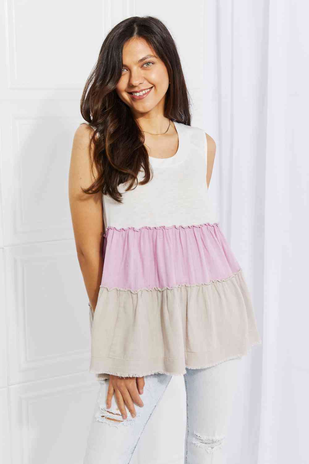 Watching the sunset color block babydoll top with tiered design, moderately stretchy.