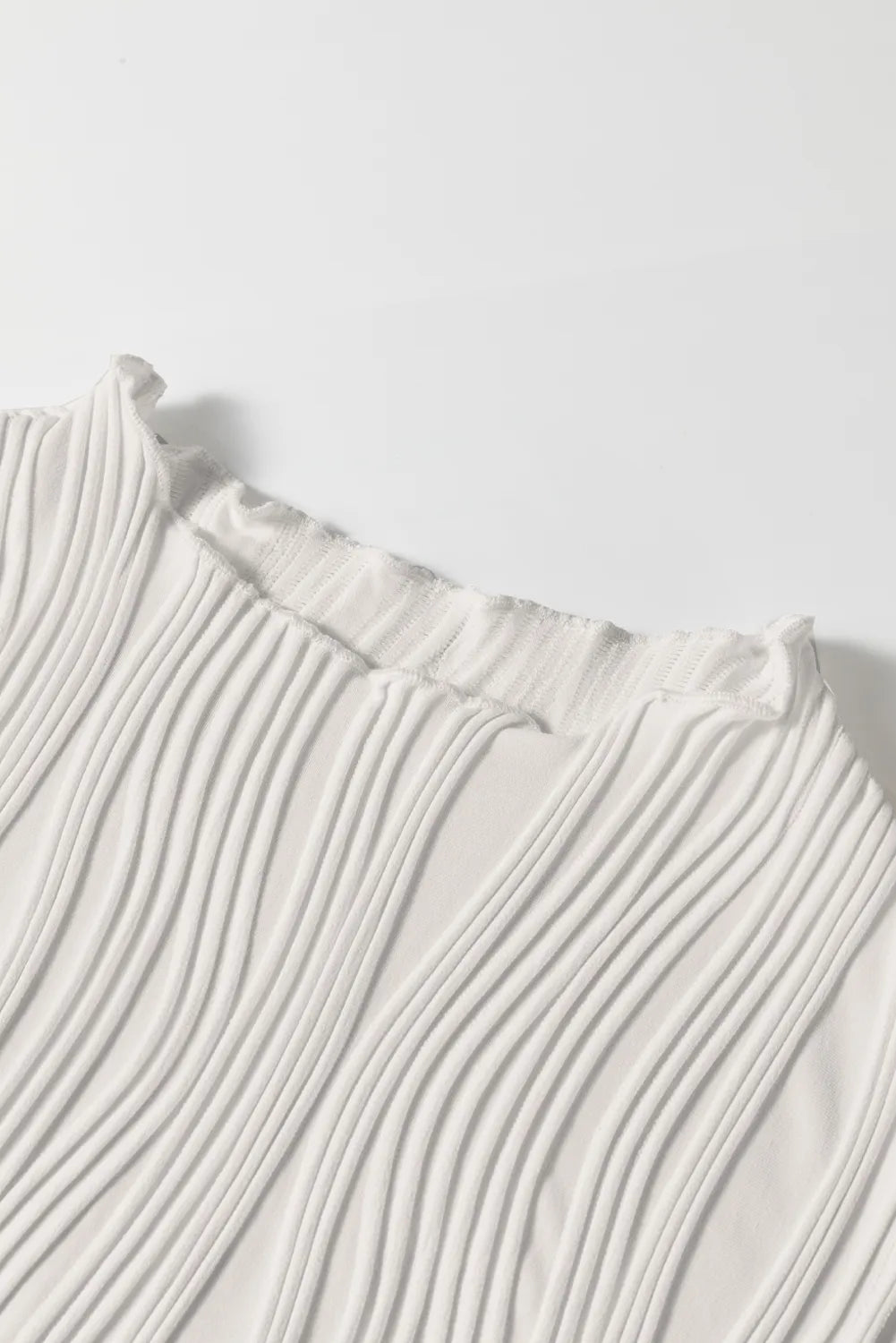 Wavy textured mock neck tank with ribbed details, slightly stretchy.