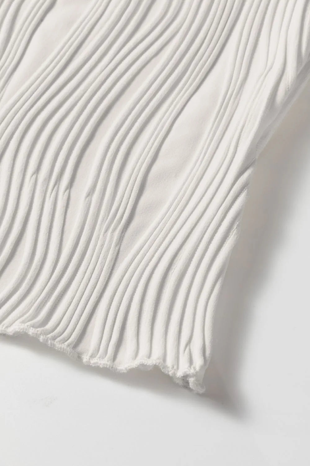 Wavy textured mock neck tank with ribbed details, slightly stretchy.