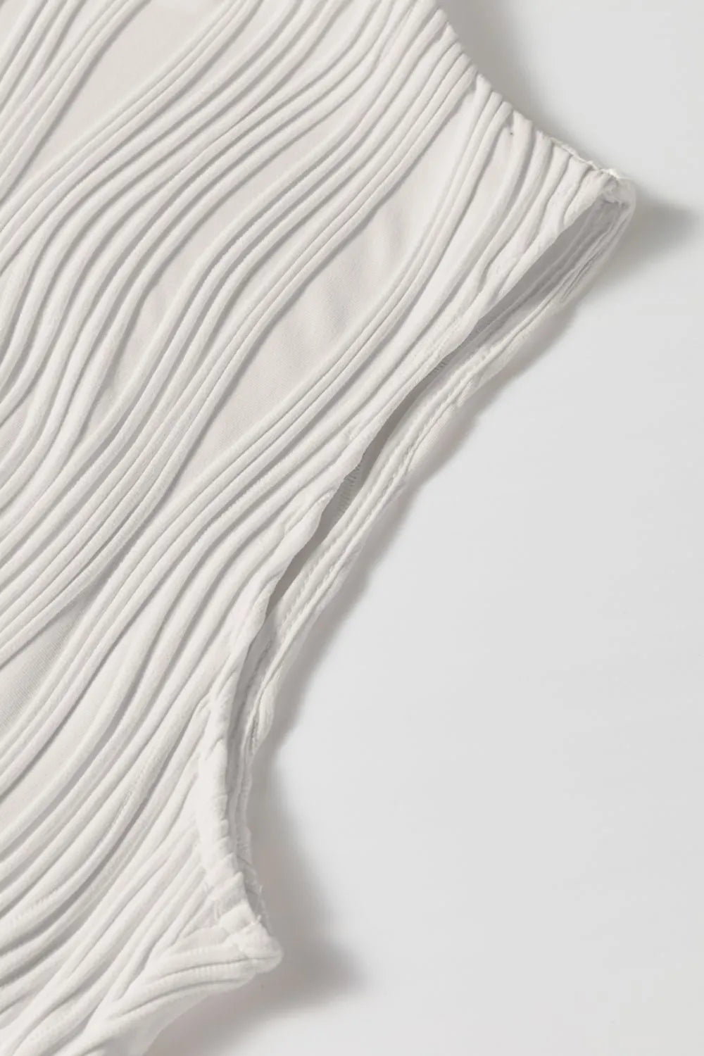 Wavy textured mock neck tank with ribbed details, slightly stretchy.