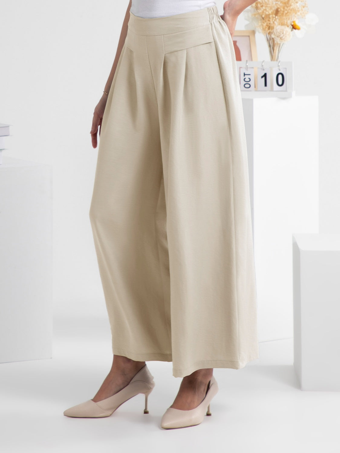 Wide leg elastic waist pants, opaque.
