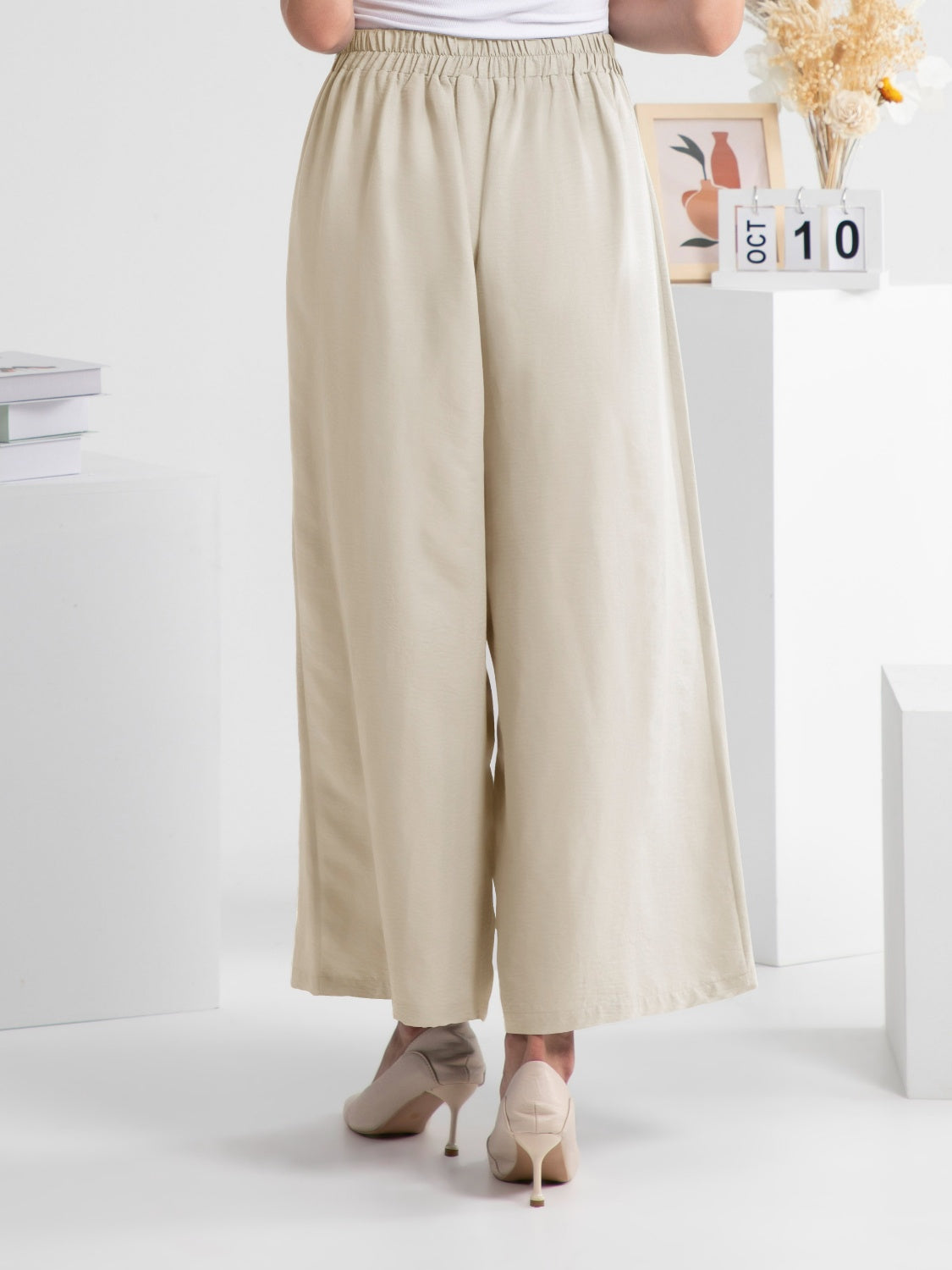Wide leg elastic waist pants, opaque.