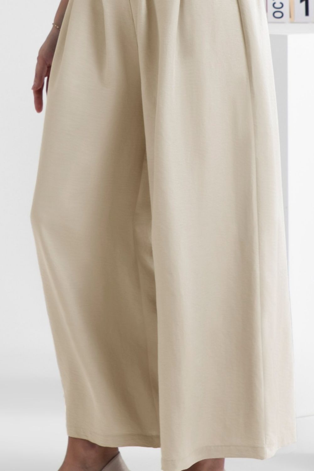 Wide leg elastic waist pants, opaque.