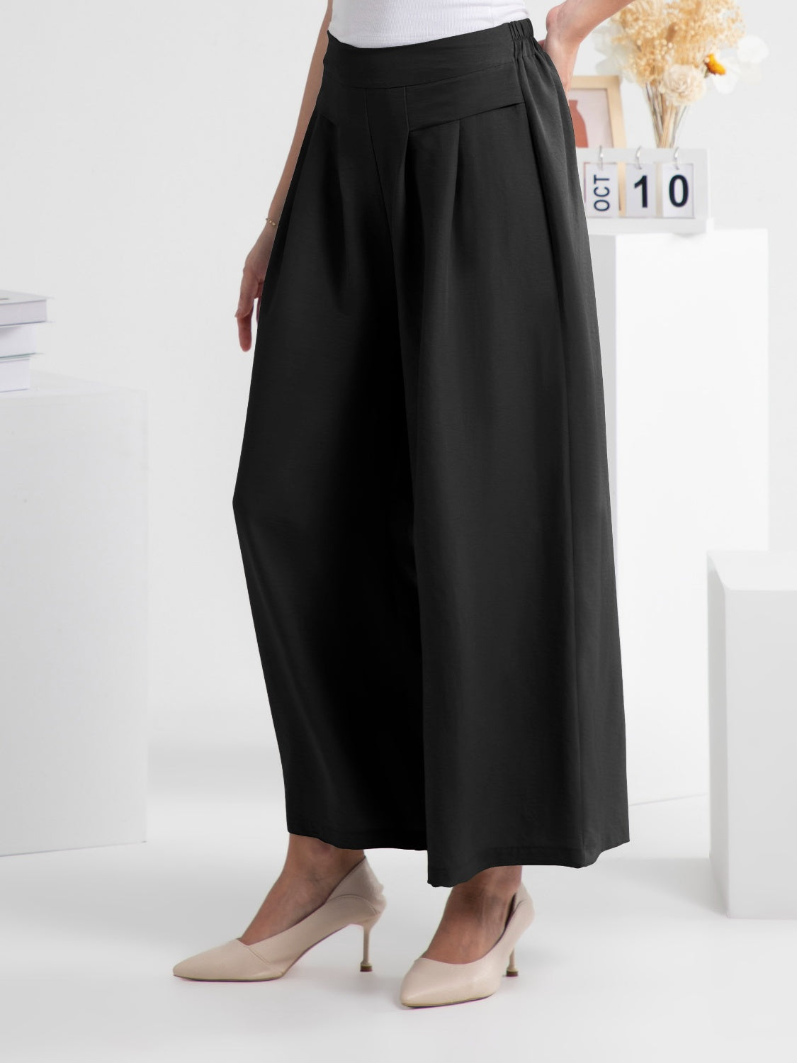 Wide leg elastic waist pants, opaque.