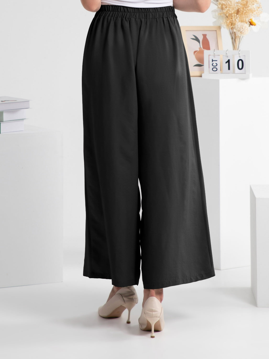 Wide leg elastic waist pants, opaque.