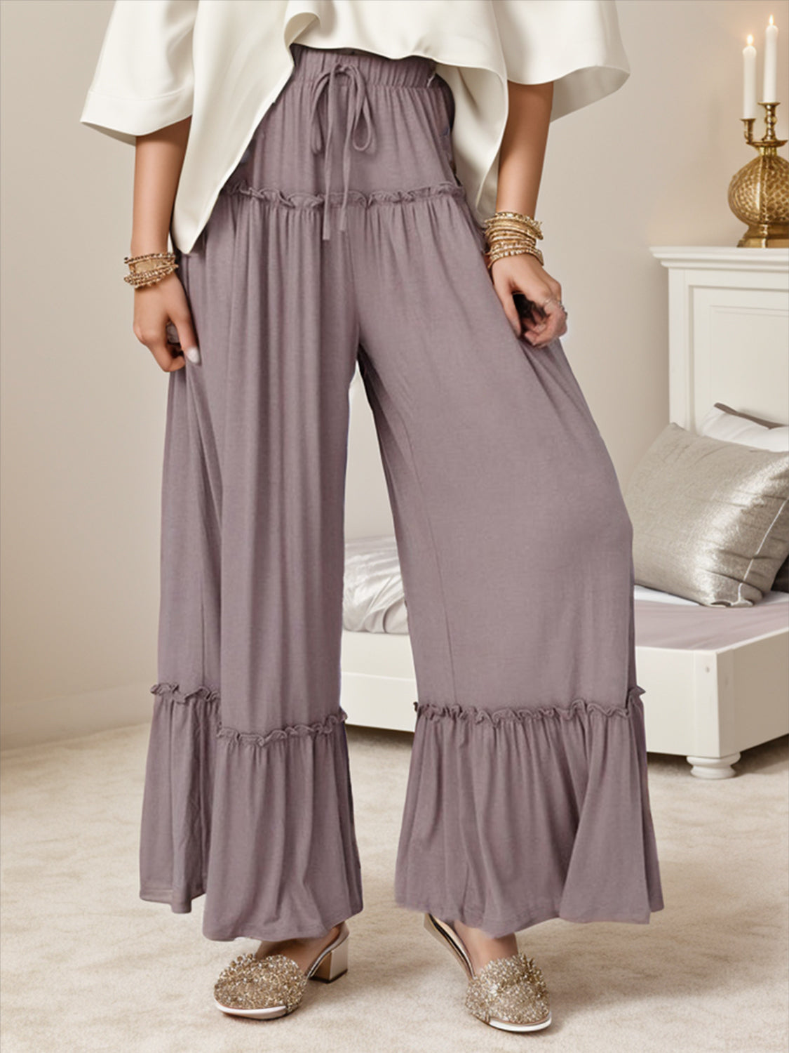 Wide leg ruffle trim pants with tie, slightly stretchy.